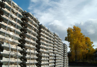 Stack of metal structure against sky