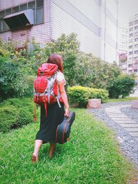 Woman standing on grass