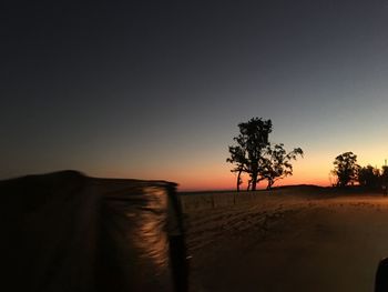 Scenic view of silhouette landscape against clear sky during sunset