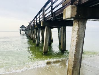 Pier over sea against sky