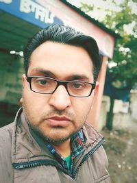 Portrait of young man wearing eyeglasses