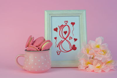 Close-up of pink roses on table