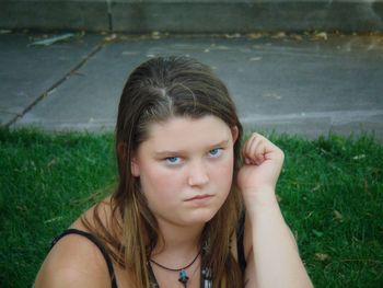 Beautiful young woman in grass