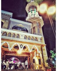 Low angle view of illuminated building at night