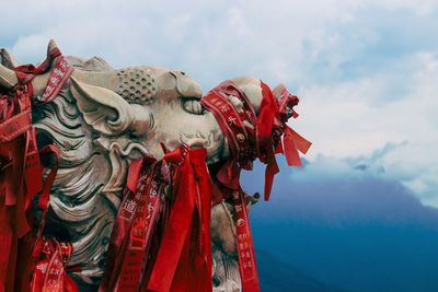 Low angle view of statue against sky