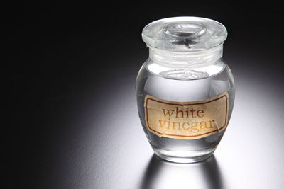 Close-up of vinegar in jar on table