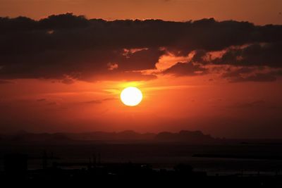 Scenic view of silhouette landscape against romantic sky at sunset