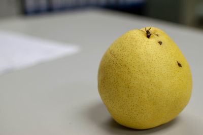 Close-up of lemon on table