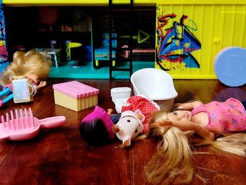 High angle view of girl with toys on table