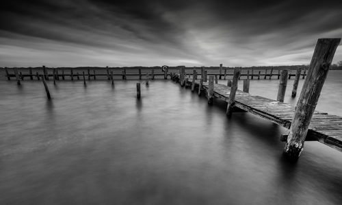 Pier over sea against sky