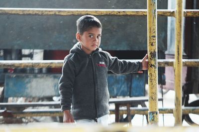 Portrait of boy standing outdoors