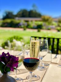 Glass of wine glasses on table