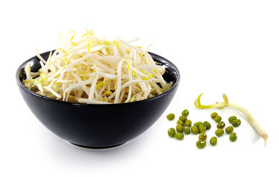 Close-up of fruit salad in bowl against white background