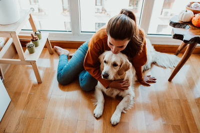 Woman with dog at home