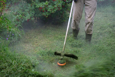 Low section of man working in yard