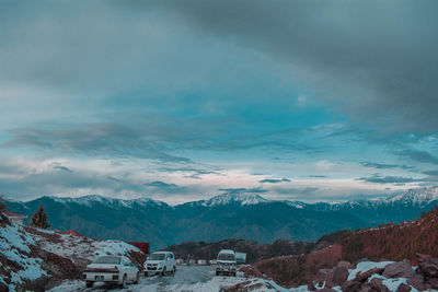 Aerial view of city against cloudy sky