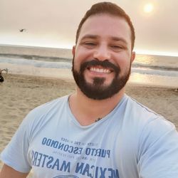 Portrait of smiling young man on beach