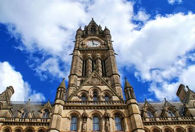 Low angle view of manchester town hall against sky