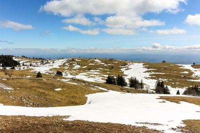 Scenic view of sea against sky during winter