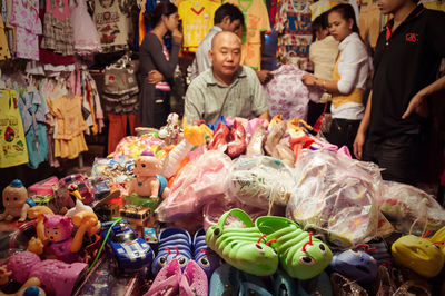 Group of people at market stall