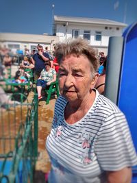Portrait of woman standing outdoors