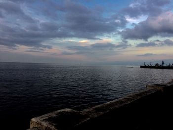 Scenic view of sea against cloudy sky