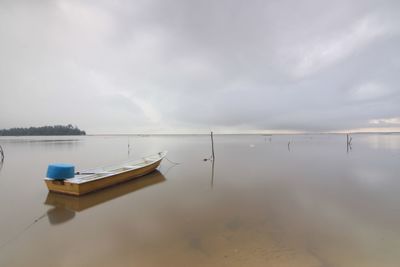 Boat in sea against sky