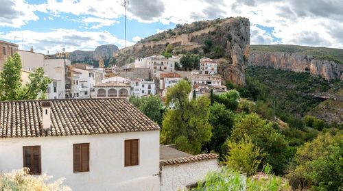 Buildings in town against sky