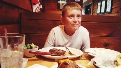 Portrait of boy eating food