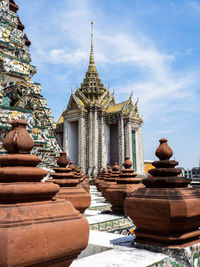 Wat arun temple, temple of dawn, with terracotta pyramids in bangkok, thailand.