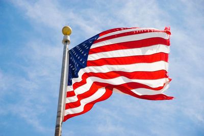 Low angle view of flag against sky