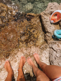 Low section of woman on rock