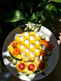 High angle view of fruits in plate on table