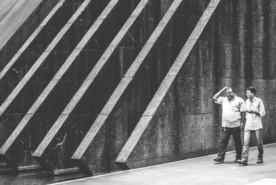 High angle view of woman standing on road