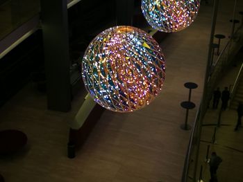 Low angle view of illuminated lights hanging on ceiling