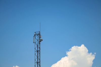 Low angle view of electricity pylon against clear sky