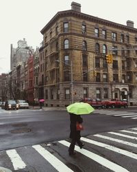 Woman standing on city street