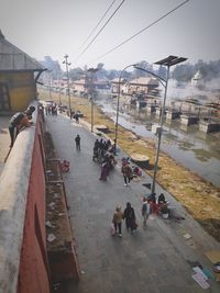 High angle view of people on street in city