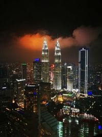 Illuminated buildings in city at night