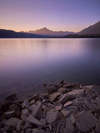 Scenic view of lake against sky during sunset