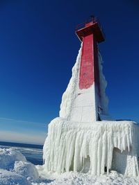 Low angle view of built structure against clear blue sky