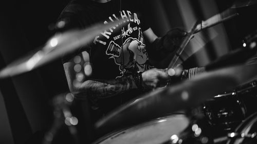 Close-up of man playing drums