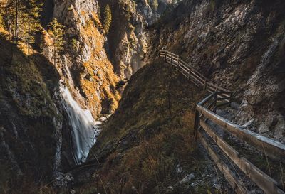 High angle view of waterfall amidst rock formations