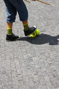 Low section of man wearing shoes