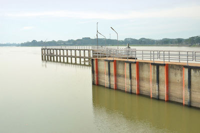 Pier on lake against sky