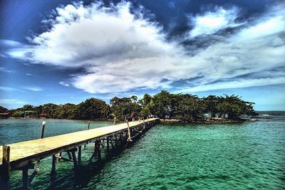 Scenic view of sea against cloudy sky