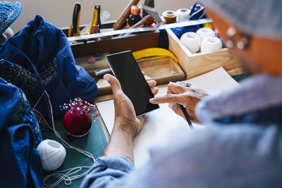 High angle view of man working on table