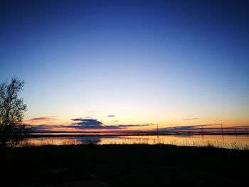 Scenic view of silhouette landscape against clear sky at sunset