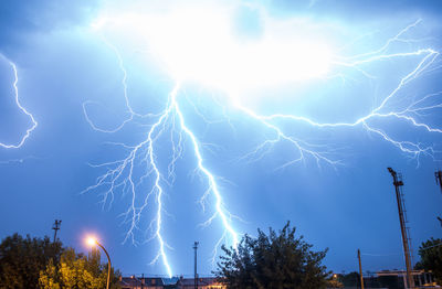 Low angle view of lightning in sky at night