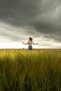 Woman standing on field